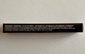 Mary Kay Signature Brow Liner blonde held in hand to show compact travel-friendly size