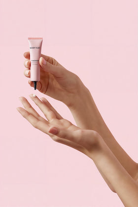 Mary Kay eye cream applied on hand demonstrating lightweight spreadability benefit