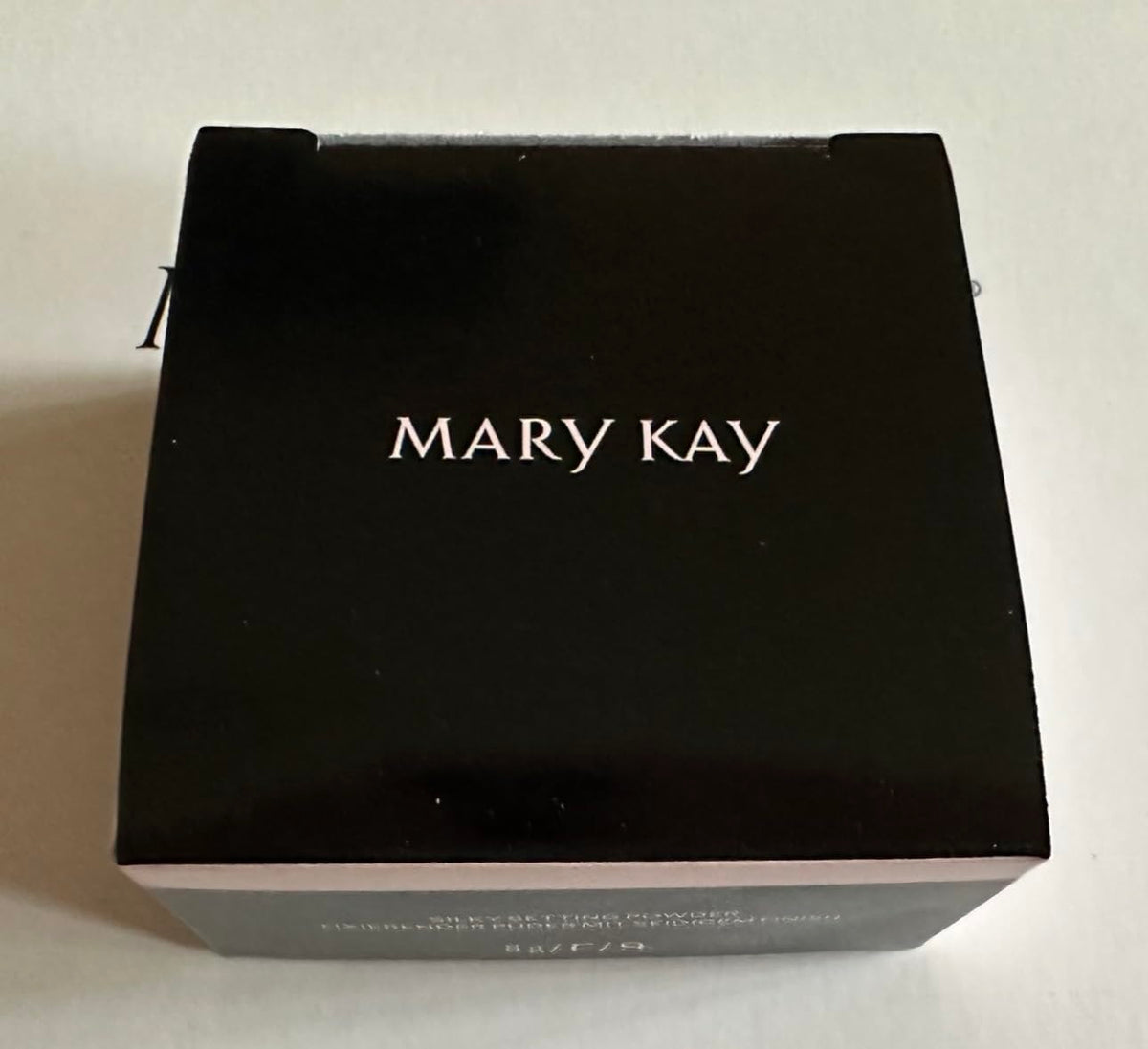 Mary Kay Silky Setting Powder with brush application demonstrating effortless setting and even coverage