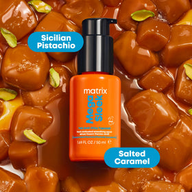Matrix serum on bathroom vanity with styling tools evoking daily routine benefit