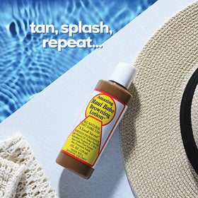 Applying Maui Babe on arm to show smooth spread and moisturizing benefit during sun exposure