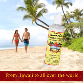 Maui Babe bottle next to hand showing actual 8 oz size and portability