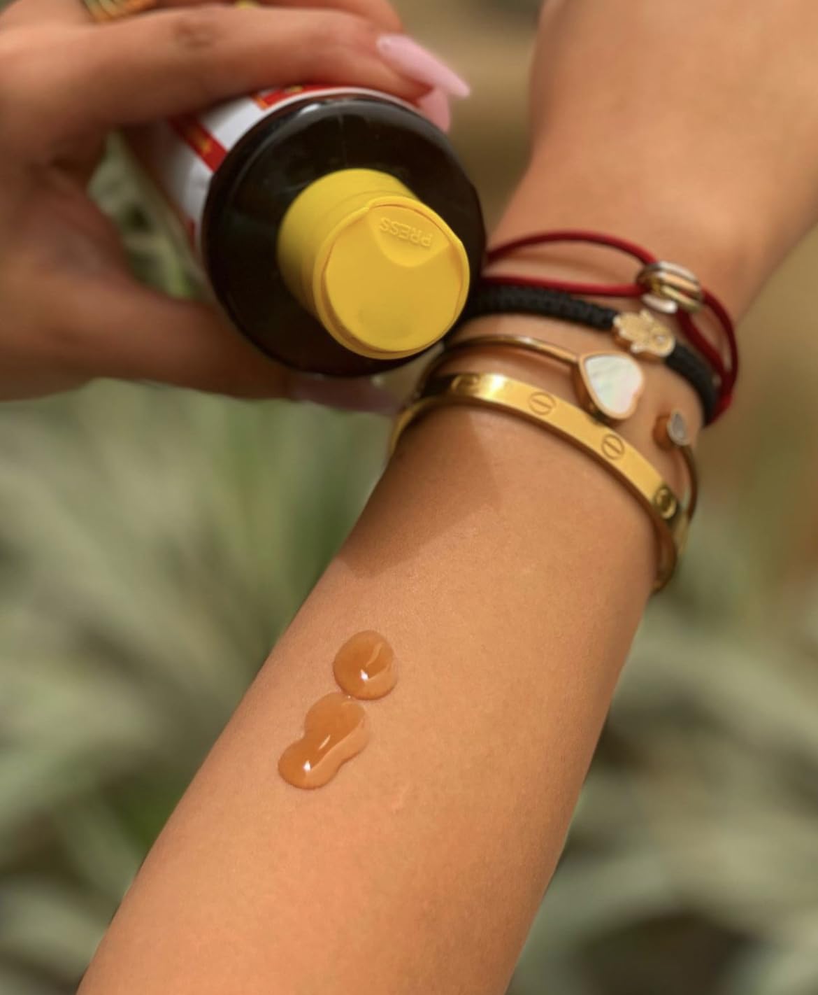 Maui Island Secret applied on skin demonstrating faster, deeper tanning