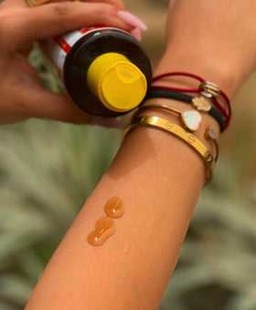 Maui Island Secret applied on skin demonstrating faster, deeper tanning