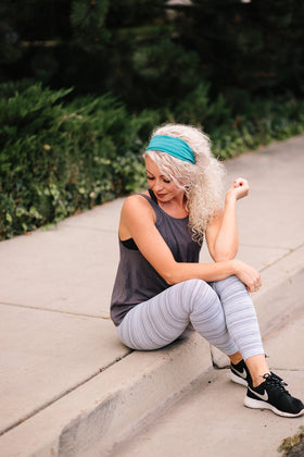 Maven Thread headband on woman doing yoga showing secure, non-slip fit