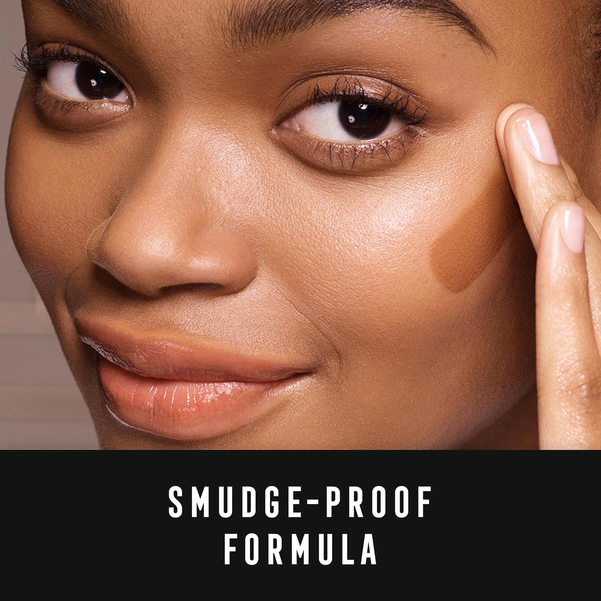 Max Factor bottle in a makeup bag showing portable 1.18 oz size benefit