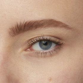 Maybelline Brow Tattoo size comparison in hand to show travel-friendly 4.9 ml