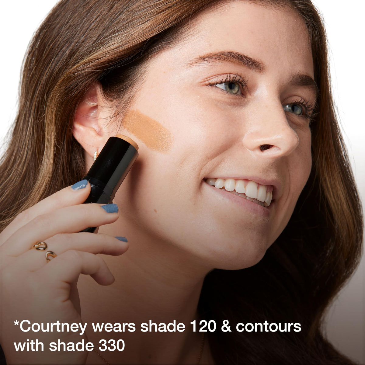 Maybelline Fit Me lifestyle daylight image of model applying stick for natural matte look
