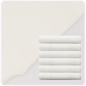 MAYOKEN stacked towels on spa shelf conveying organized storage and professional readiness