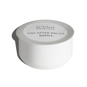 m'chel front packaging showing compact refillable brush benefits portability
