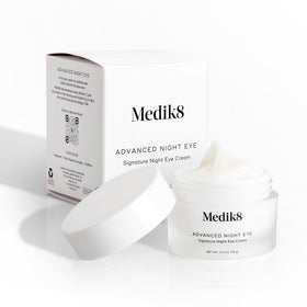medik8 on nightstand lifestyle scene conveys nightly use and bedtime skincare ritual