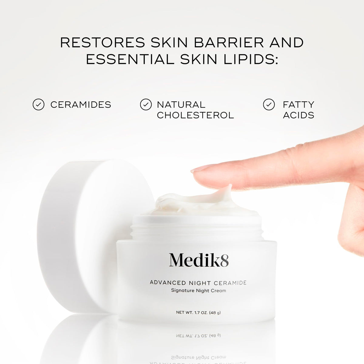 Medik8 cream on fingertip demonstrating spreadability and lightweight absorption