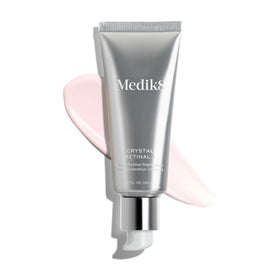 Medik8 bottle on bathroom counter in nighttime routine, supports evening skin renewal benefit