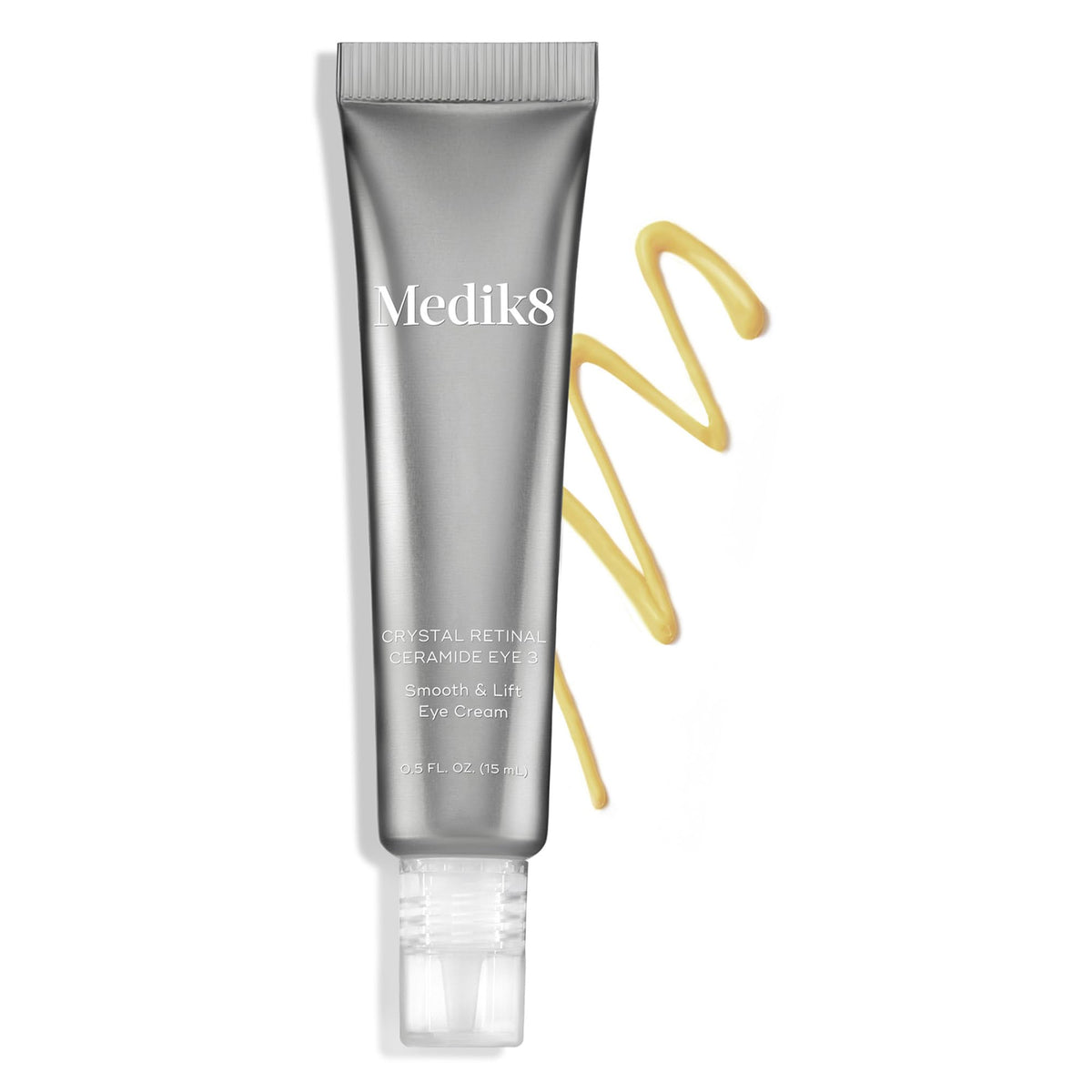 Medik8 0.5 oz tube beside a coin for scale showing compact travel-friendly size