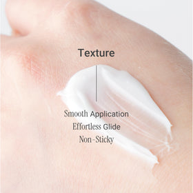 Meebak cream on fingertip demonstrating lightweight spreadability and fast absorption