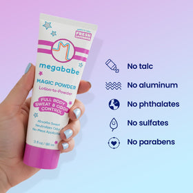Megababe 3 fl oz bottle in hand showing travel-friendly size