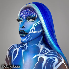 Mehron CreamBlend Stick blue swatched on hand to show color payoff and buildability