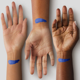 Mehron CreamBlend Stick blue applied on face demonstrating precise application detail