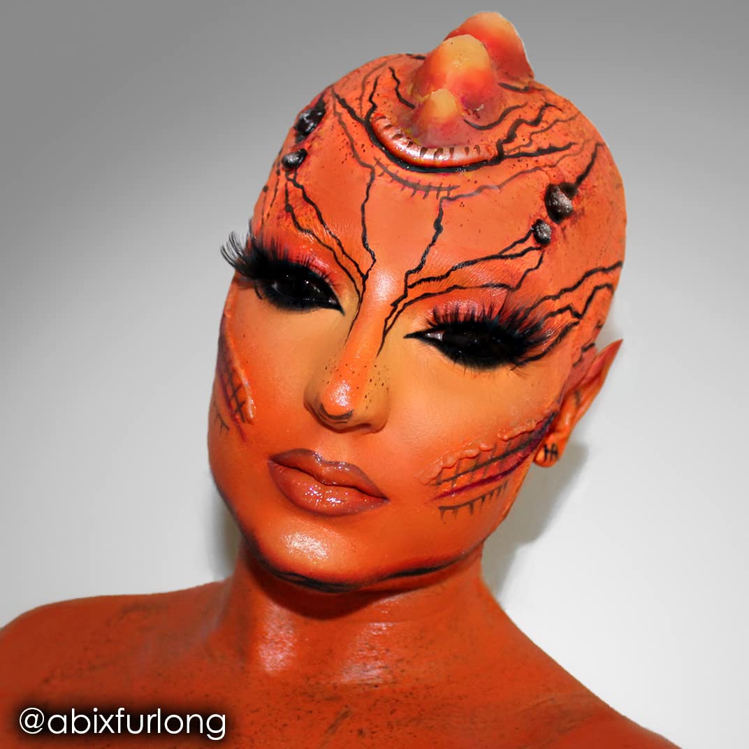 Mehron CreamBlend stick applied on arm showing bold orange payoff for testing