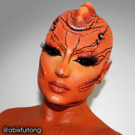 Mehron CreamBlend stick applied on arm showing bold orange payoff for testing