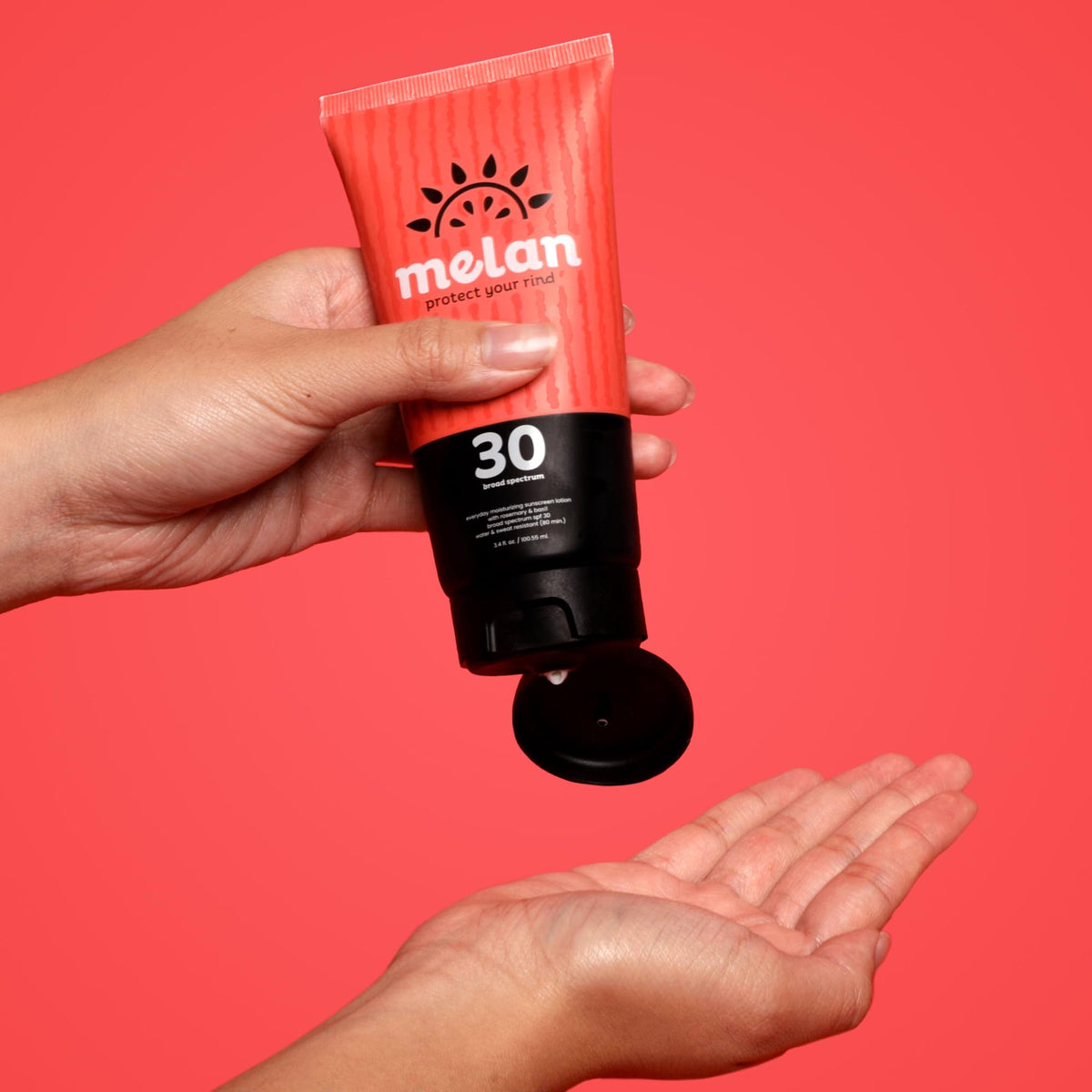 melan sunscreen in use at the beach showing water-resistant active protection