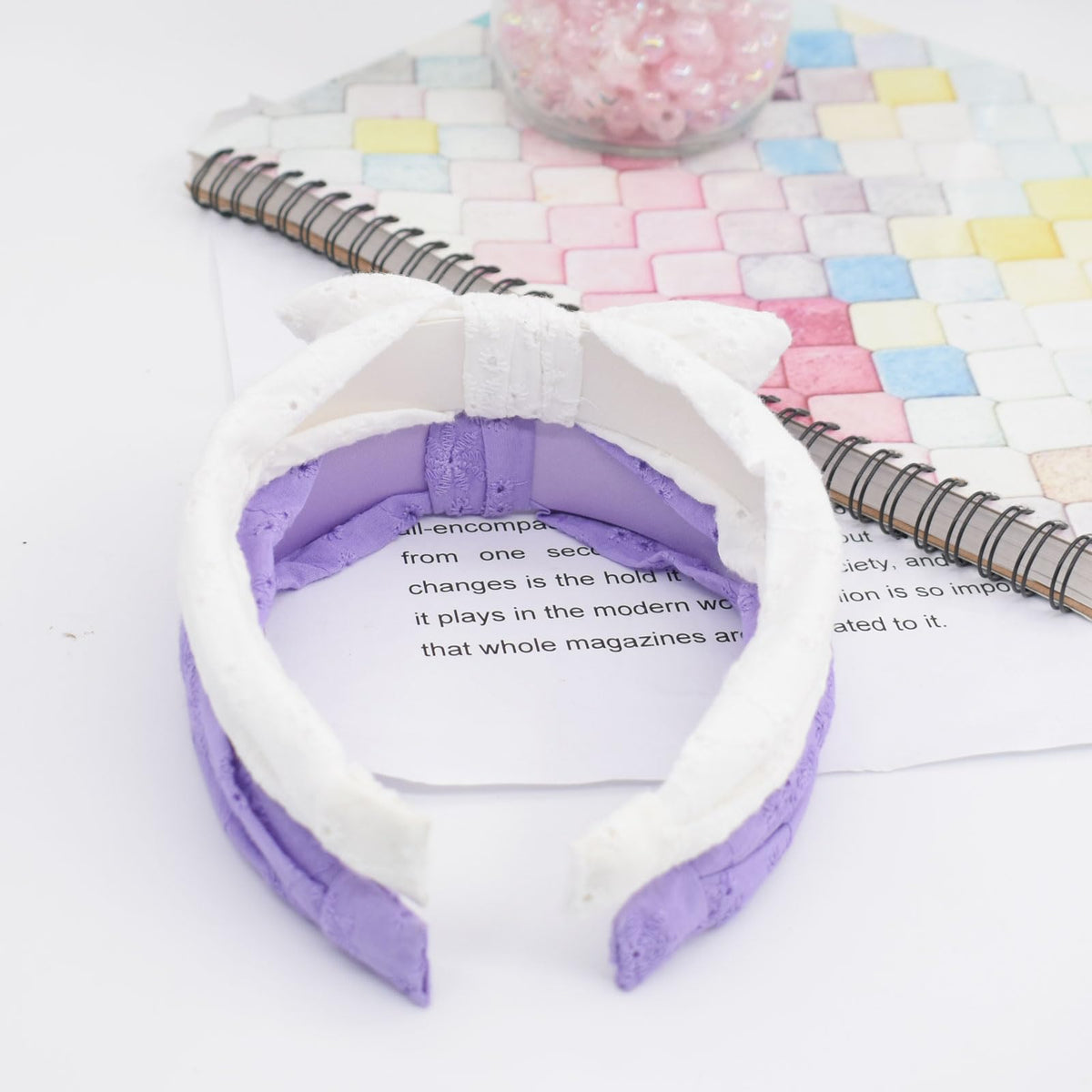 Melbelia headband beside coin showing size and adjustable fit benefit