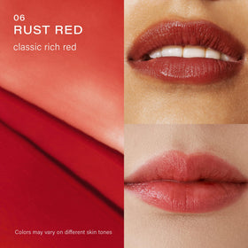 Melixir lip butter on model closeup illustrating sheer rust-red tint and hydrated lips