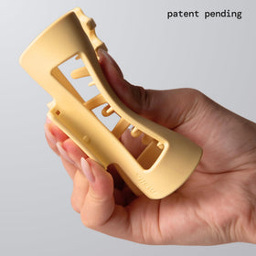 MELLO side profile highlighting curved teeth and soft grip benefit
