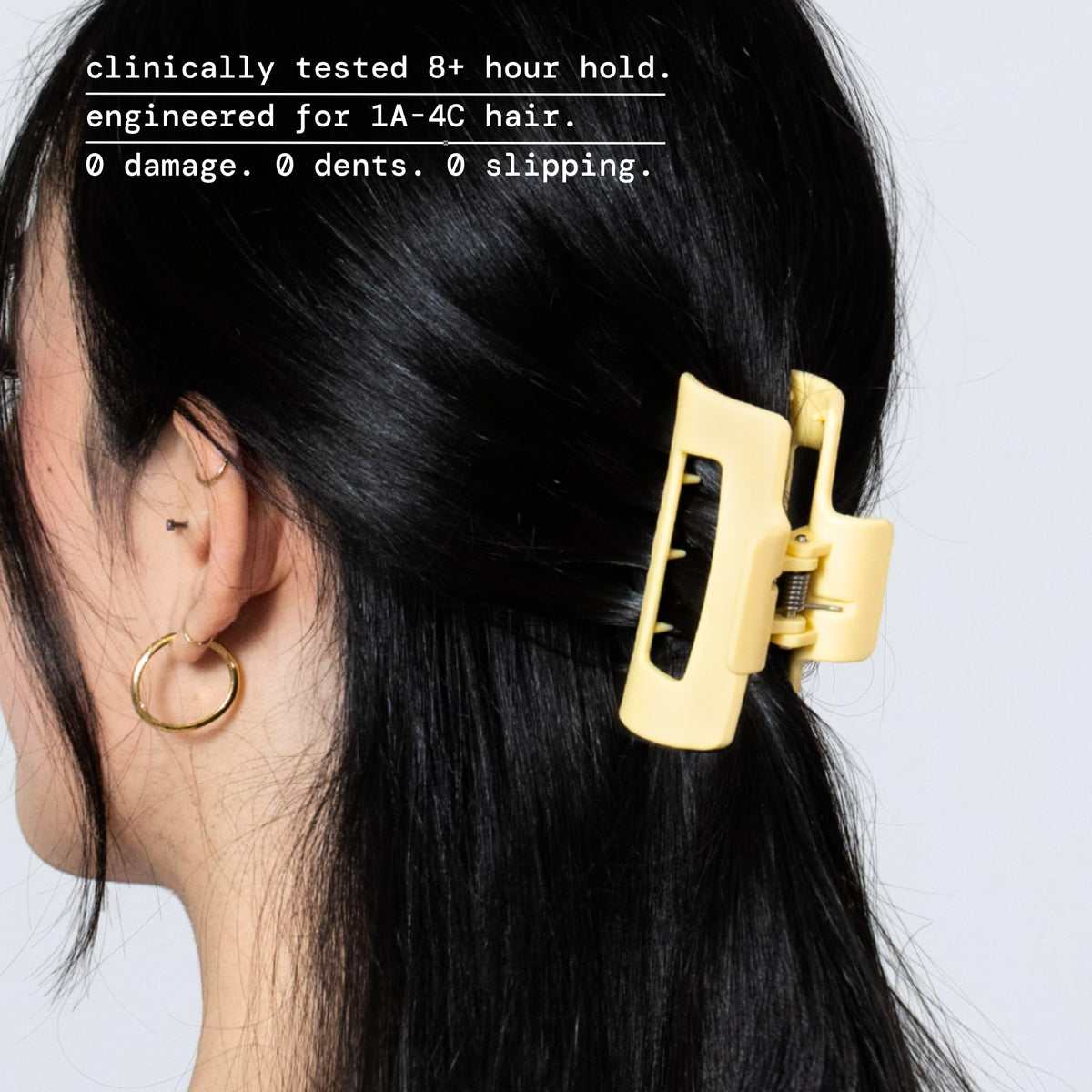 MELLO side view showing inward-curving teeth for scalp comfort