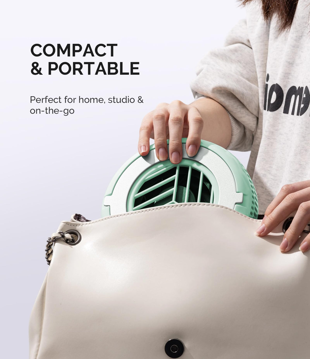 MelodySusie HProA held in hand for scale, lightweight portability benefit