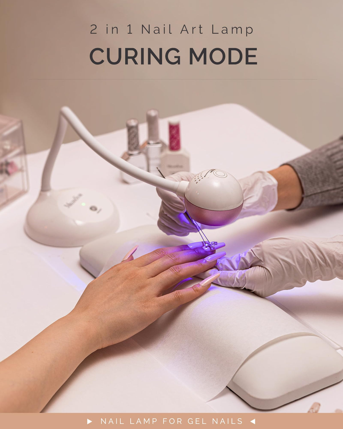 MelodySusie lamp curing rhinestone glue on a nail for precise embellishment setting