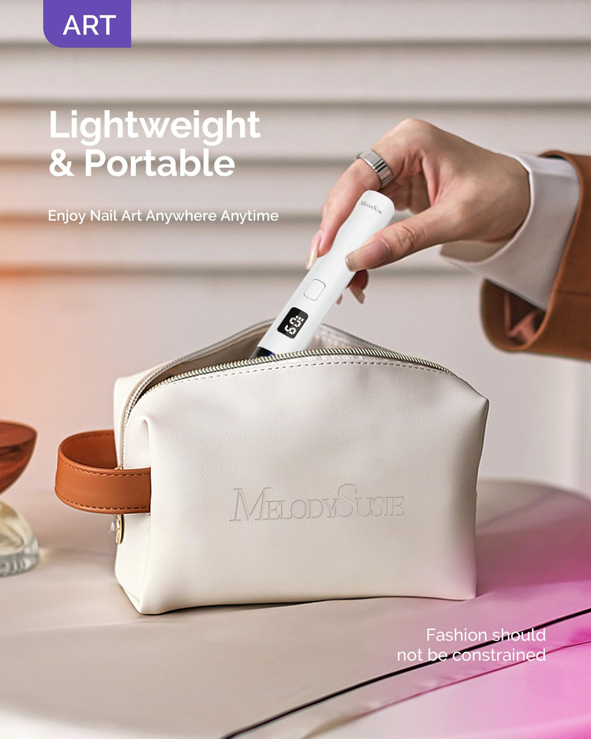 MelodySusie held in hand showing portable size for on-the-go use