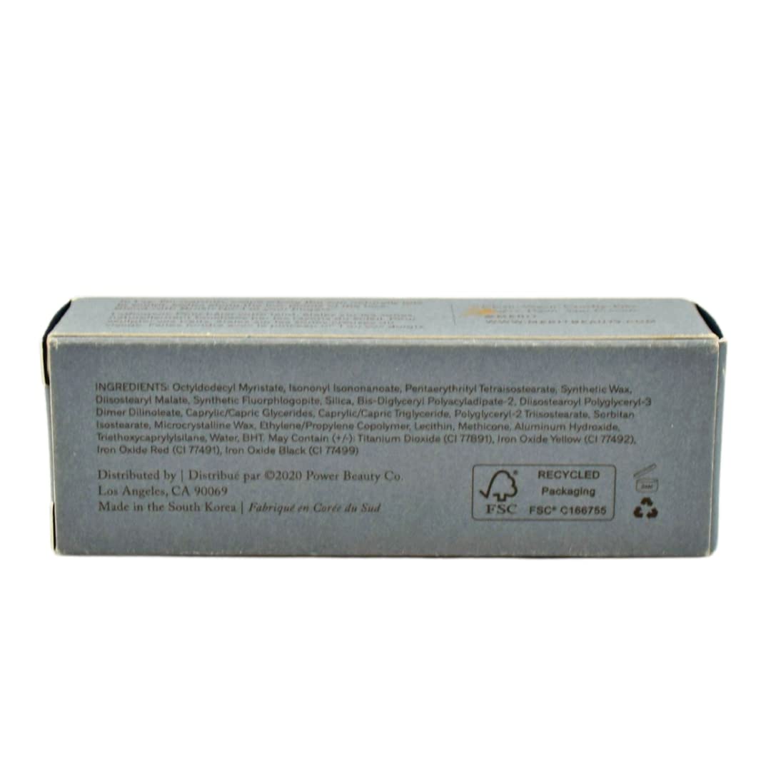 MERIT bronze balm being blended with finger showing easy application benefit