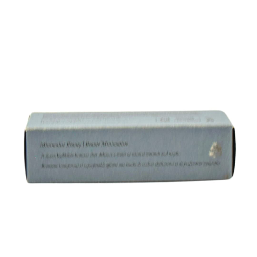 MERIT bronze balm inside a makeup bag showing compact travel-friendly size