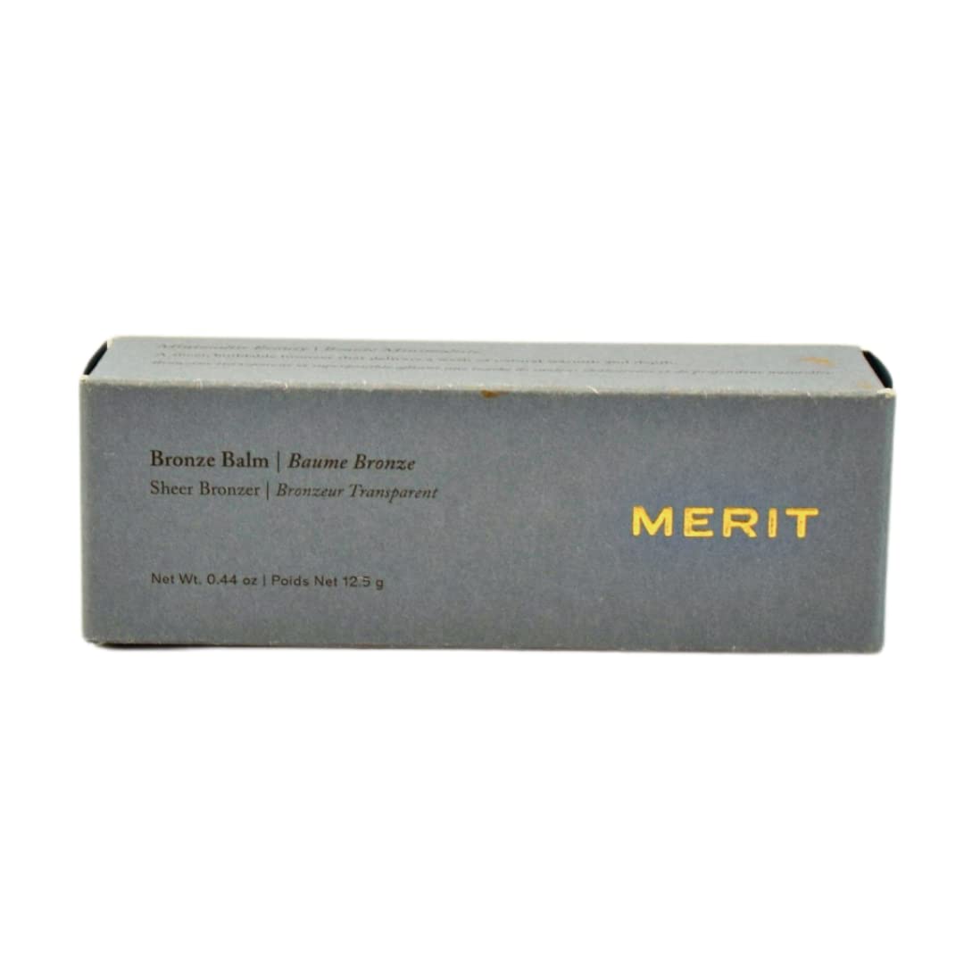 MERIT bronze balm open tube revealing balm stick ready for targeted use