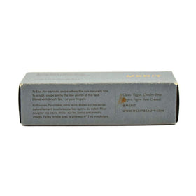 MERIT bronze balm swatched on skin arm demonstrating sheer buildable color