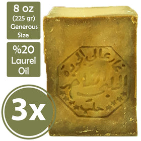 Merlinera Aleppo soap cut to reveal green core and brown rind, highlighting natural laurel benefit