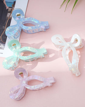 Mesovor bow clip worn with birthday outfit adding elegant detail