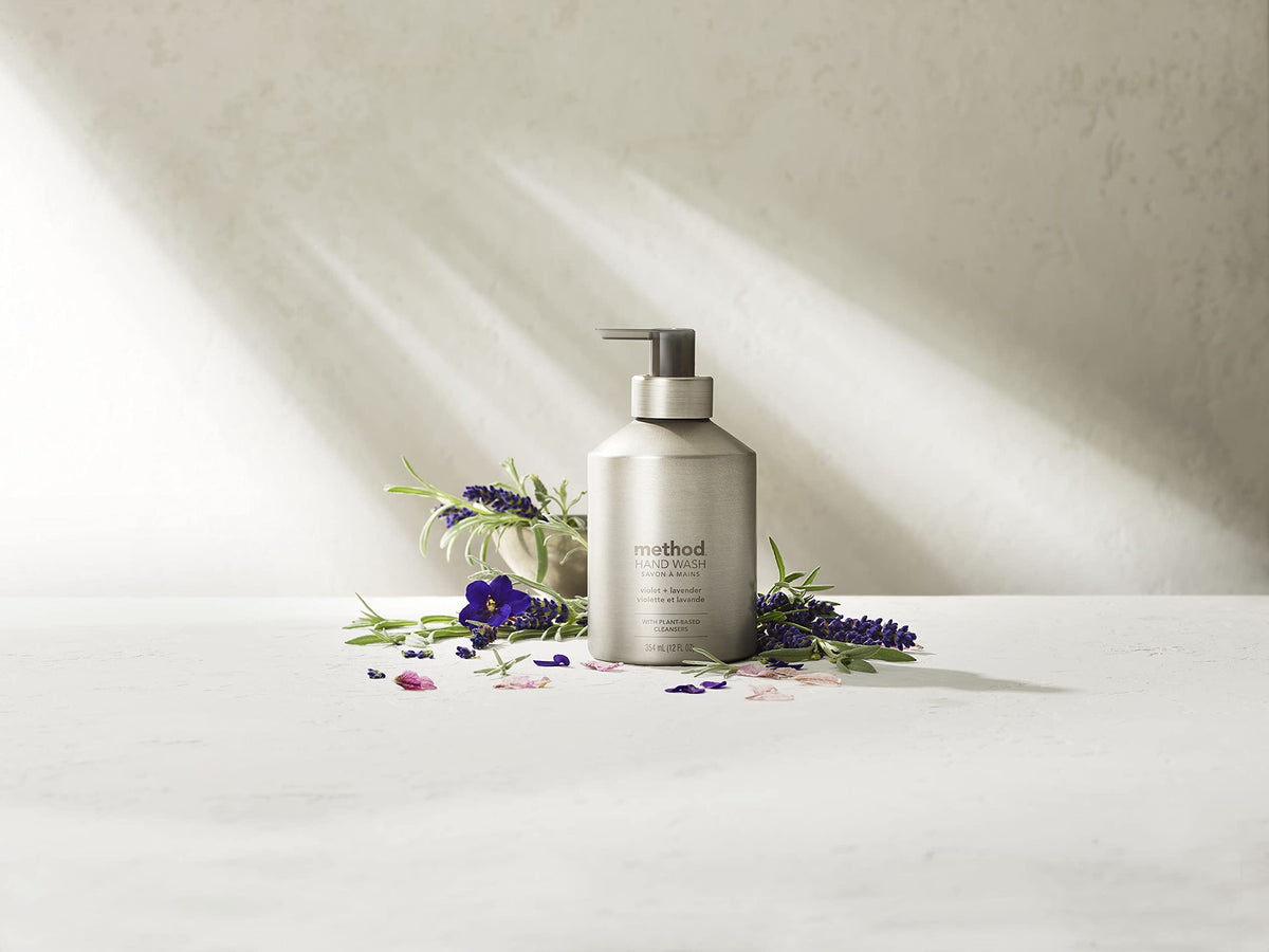 Method on vanity next to sink showing reusable bottles enhancing decor