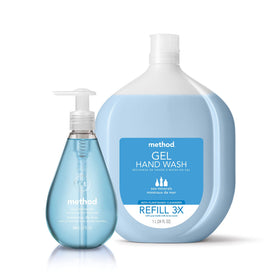 Method pink grapefruit bottle on bathroom sink showing soft-scented hand care benefit