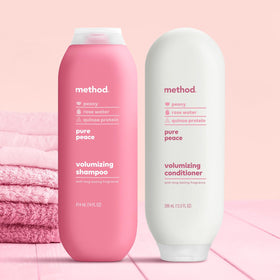 Method Pure Peace bottle held in hand showing scale and generous product size