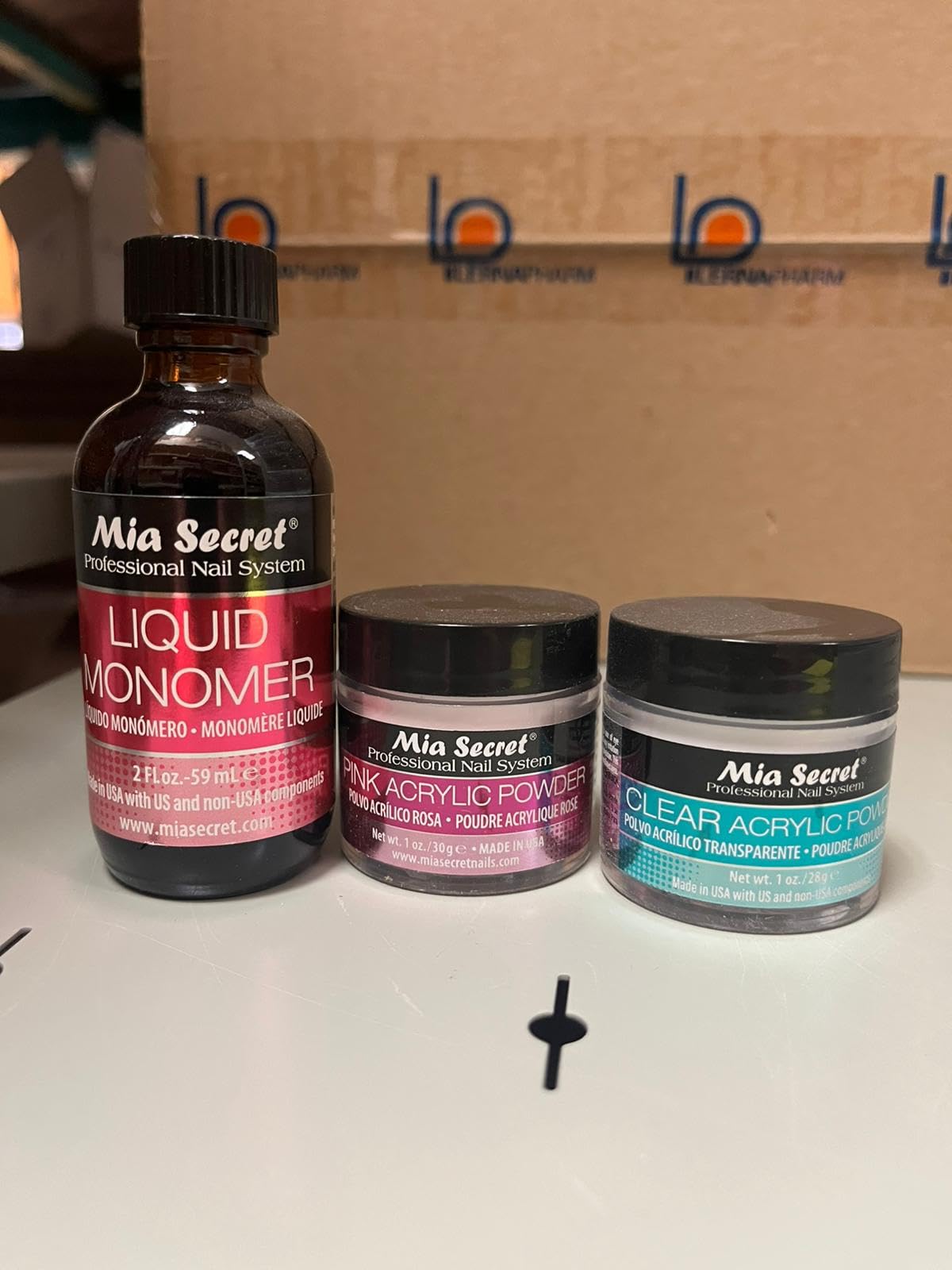 Mia Secret 2oz liquid monomer bottle close-up for controlled mixing