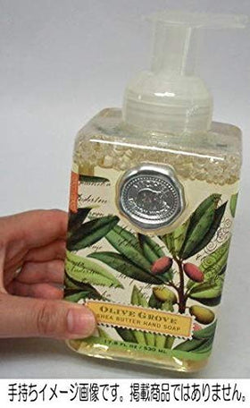 Michel Design Works bottle staged on a vanity with towel, adds coastal decor and convenience