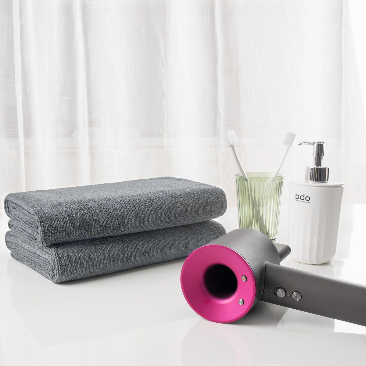 MICROFI folded towel next to hand showing generous size and easy handling