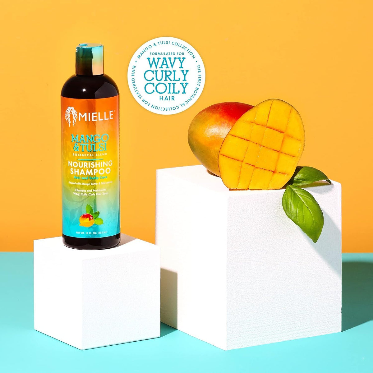 Hand-held Mielle Organics bottle demonstrates travel-friendly 6 fl oz size benefit