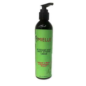 Mielle Organics styling crème applied to hair demonstrating frizz control and smooth styling benefit