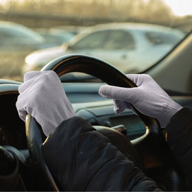 MIG4U gloves styled on bed to show protection of sheets from lotion