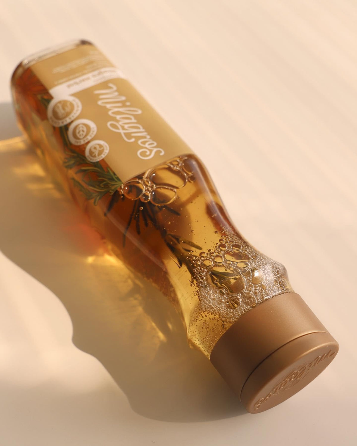 MILAGROS shampoo in use on hair showing cleansing and scalp massage