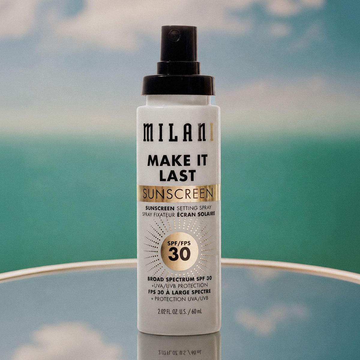 Milani misting on bare skin demonstrating refreshing SPF boost