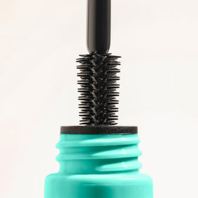 Milani tubing mascara ingredients shot with shea butter and castor oil highlighting conditioning
